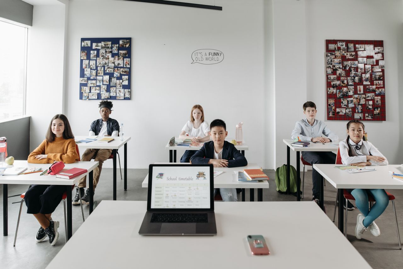 Home A classroom with diverse students focused and engaged in a learning environment.